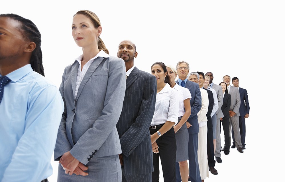 Successful business people lined up in over white background